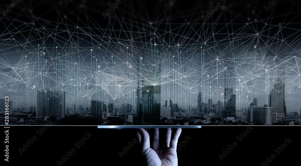 Poster Hand show digital tablet display Wireless network and Connection technology concept covering on Abstract building city.
