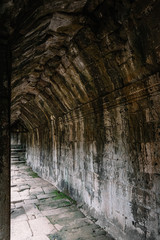 Huge corridor made of rustic rocks in the ruins of Arkgon Thom in Cambodia - Unesco World Heritage in 1992