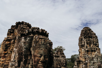Fototapeta premium Large Ankgor Thom statues in the shape of ancestral faces in Cambodia - Unesco World Heritage in 1992