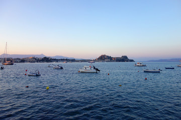 Fototapeta na wymiar Boats on sea during sunset