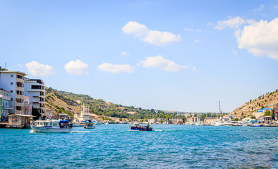Balaklava bay in summer in sunny weather. Crimea, Russia. A lot of boats and ships. Bay for boats.