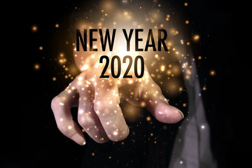 Year 2020 with hand.