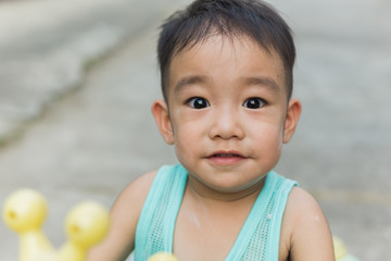 Asian cute boy smiling and looking at camera. Children portrait.