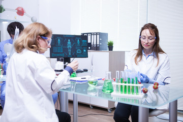 Team of different ages of scientist team in a research lab