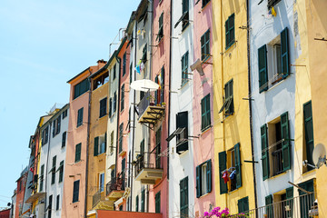 Fototapeta na wymiar colorful house facades with balconies and typical shutters in the old town of portovenere, liguria, italy