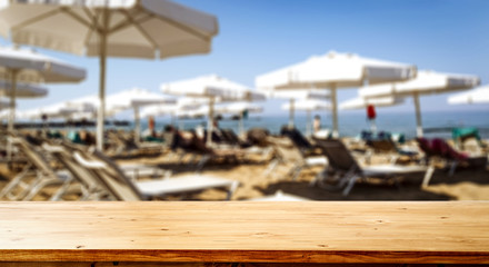 desk of free space and beach background 