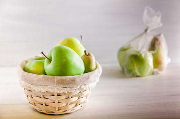 concept plastic free fruit in a plastic bag and wicker basket