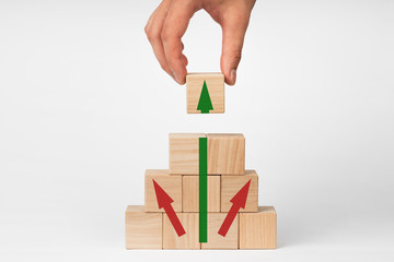 Wooden cubes with up arrow. Growth concept