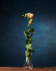 flower against the background of a painted background, old chest of drawers, empty space for the...