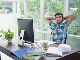 young man working at home and relex,businessman works on his computer to get all his business