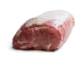 Fresh pork shoulder joint with cooking cord isolated on white. Ready for cooking.