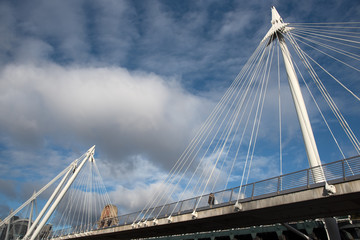 The famous historic Hungerford suspension Bridge crossing the river Thames in London United Kingdom