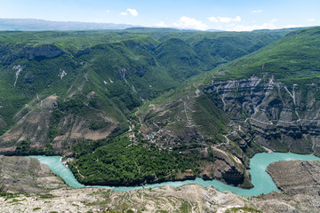The turquoise River at the bottom of a canyon 