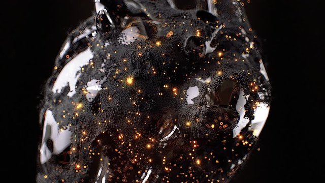 Stock motion graphics video shows a close-up shot of a glass heart rotating on a black background