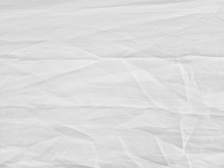 Soft white wrinkled fabric background