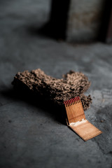 A match box with a giant picture drawn in front of the box