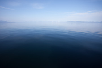 Blue Calm Ocean Water Meets Blue Sky at the Horizon