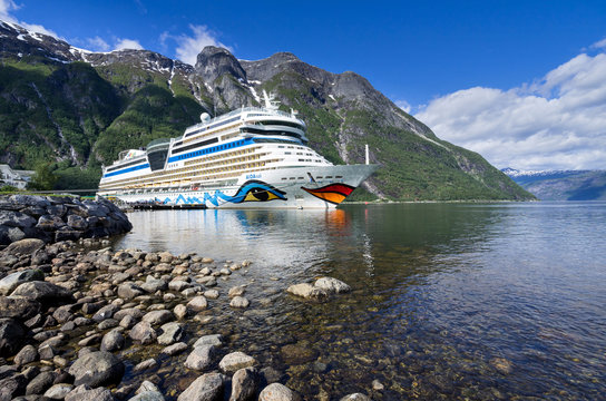 EIDFJORD, NORWAY - June 11, 2017: AIDAsol at Eidfjord Cruise Terminal. AIDAsol is a Sphinx class cruise ship, built at Meyer Werft for AIDA Cruises, one of ten brands owned by Carnival Corp.