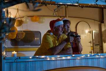 Senior surfer couple waiting new year in their camping trail