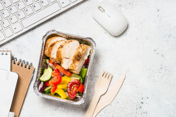 Food delivery concept - lunch box on office table.