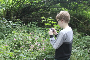 Young boy using a camera