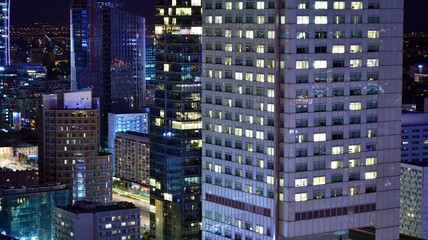 Fototapeta na wymiar Modern office building at night. Night lights, city office building downtown, cityscape view