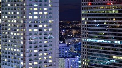 Fototapeta na wymiar Modern office building at night. Night lights, city office building downtown, cityscape view