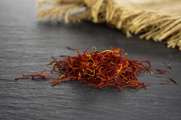 Lot of whole dry shaffron thread and jute cloth on grey stone