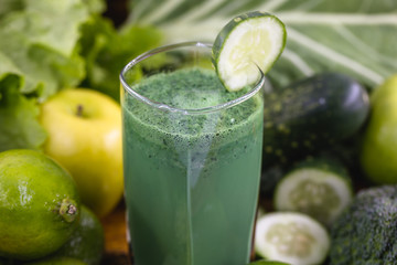 Fresh green juice, Brazilian detox juice. drink that has components that favor liver cleansing, Green smoothie with ingredients on wood table, healthy food concept. Diet or regimen concept.