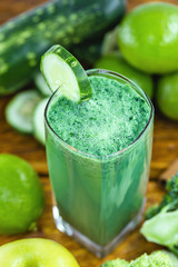 Fresh green juice, Brazilian detox juice. drink that has components that favor liver cleansing, Green smoothie with ingredients on wood table, healthy food concept. Diet or regimen concept.