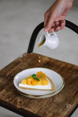 hand holding egg on plate