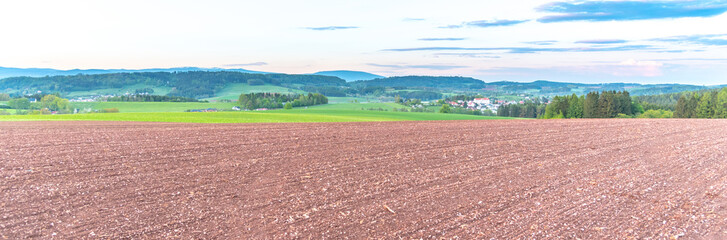 Rural agricultural landscape. Red soil fields around Nova Paka, Czech Republic