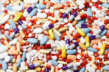 multicolored pills, healthcare and medicine