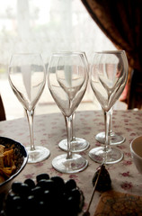  Five empty wine glasses on the table
