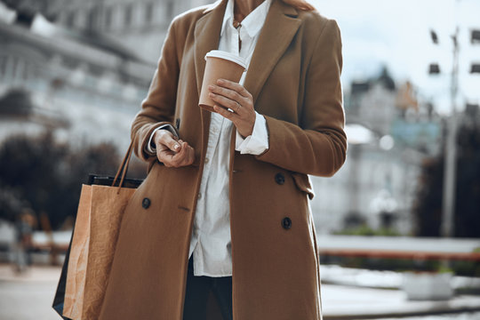 Paper cup of coffee in hand of woman stock photo