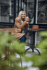 Enjoying tasty coffee alone outdoors stock photo