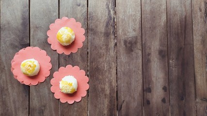 pastry on red pad on wood background
