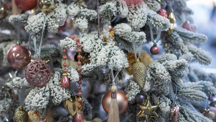 Closeup of pine branch with decorations. Christmas and New Year holiday background. Vintage color tone. Copy space for your text.