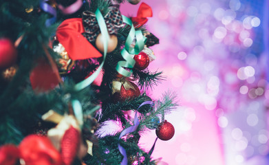 Festive decor in winter holidays. Shining garland lights. Magical atmosphere. Blurred background with Christmas illuminations.