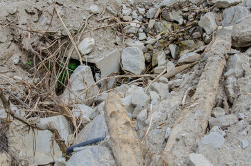 Debris in riverbed after mudflow.