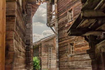 Foto op Plexiglas Wooden houses and sheds in rural village in Swiss alps in Valais valley on a summer day © Mario