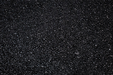 Dark asphalt roadbed.