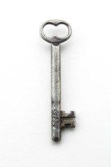 Antique vintage key on white background