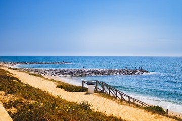 Figueira da foz beach Portugal. Summer day in Europe. Boho style coloured style photo.  Over processed.