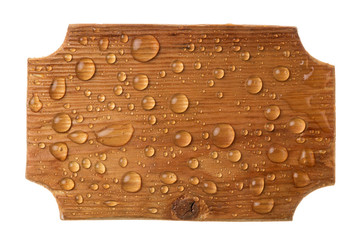 Carved wooden frame in drops of rainwater on a white background.