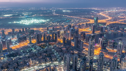 Downtown of Dubai night to day timelapse before sunrise. Aerial view with towers and skyscrapers