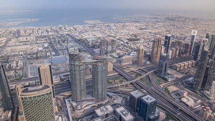 Downtown of Dubai in the morning timelapse after sunrise. Aerial view with towers and skyscrapers