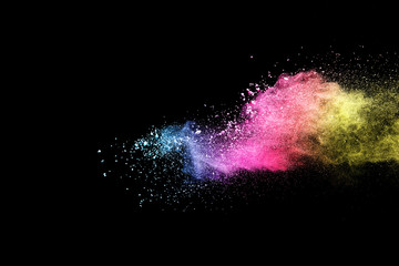 Explosion of colored powder isolated on black background. Abstract colored background. holi...
