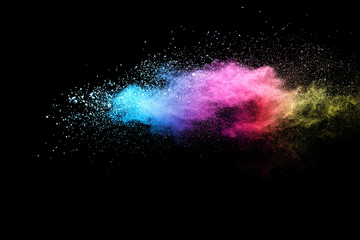Explosion of colored powder isolated on black background. Abstract colored background. holi...