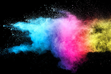 Explosion of colored powder isolated on black background. Abstract colored background. holi festival.